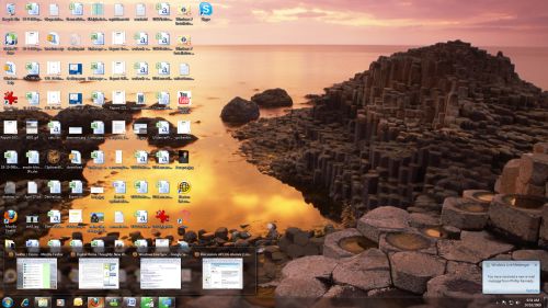 Windows 7 Desktop. Note the green progress bar on two of the Taskbar icons. Windows 7 Desktop. Note the green progress bar on two of the Taskbar icons.